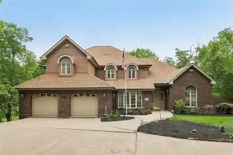 Cul-de-sac Wooded Retreat with 5-car Garages