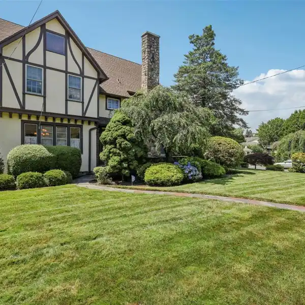 EXPANSIVE CENTER HALL TUDOR HOME