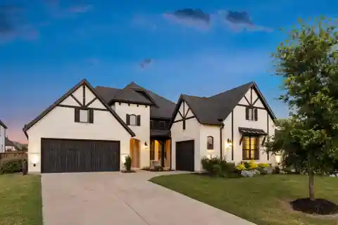 Modern Tudor Charm in the Heart of the  Mustang Lakes