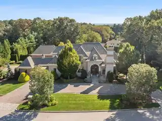 Custom Brick & Stone Masterpiece with 5 Ensuite Bedrooms