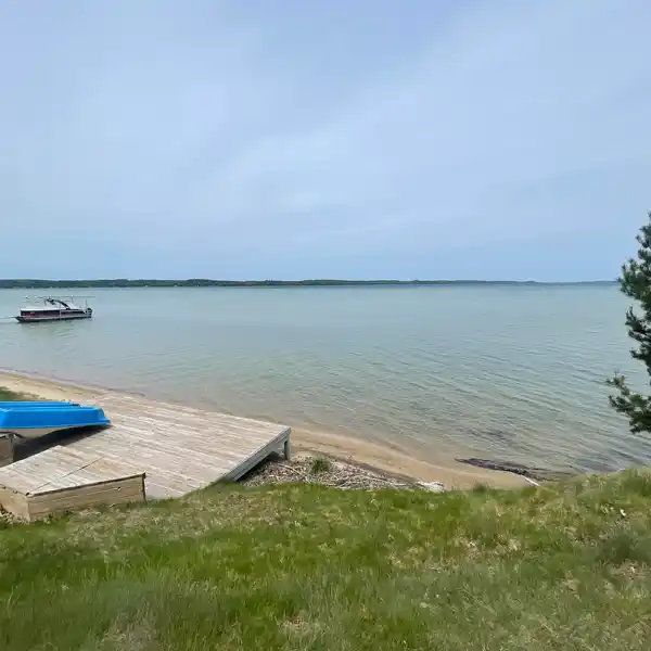 TORCH LAKE LEGACY LOT WITH HISTORIC SUMMER HOUSE