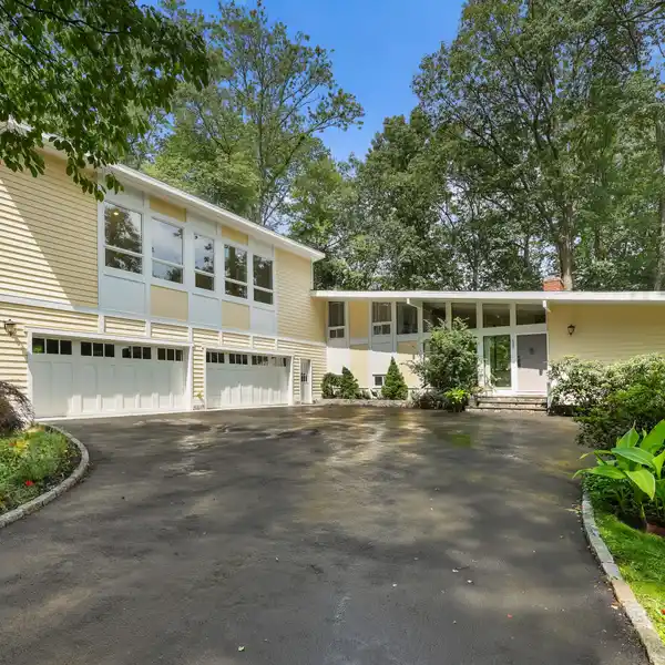 SPACIOUS SUN-FILLED HOME ON A LANDSCAPED ACRE
