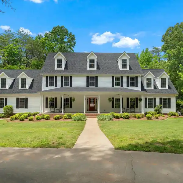 STUNNING HOME ON A GORGEOUS 4+ ACRE PRIVATE LOT
