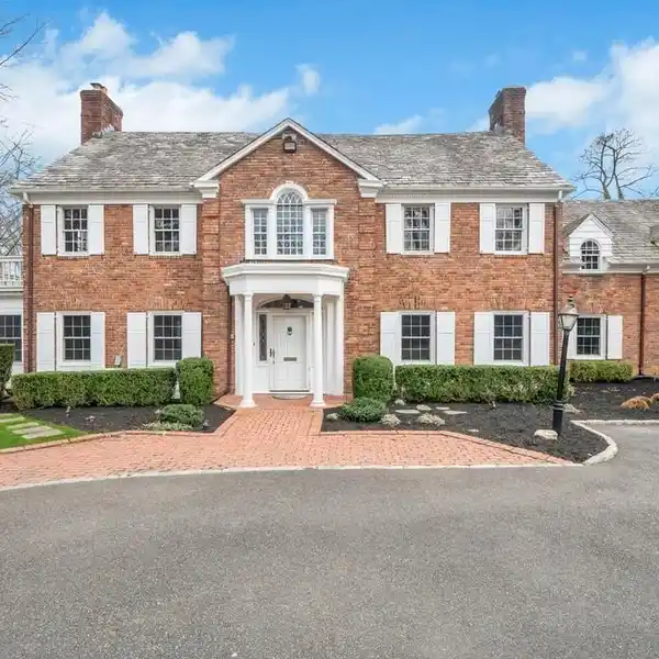 GRACIOUS AND GRAND BRICK CENTER HALL COLONIAL