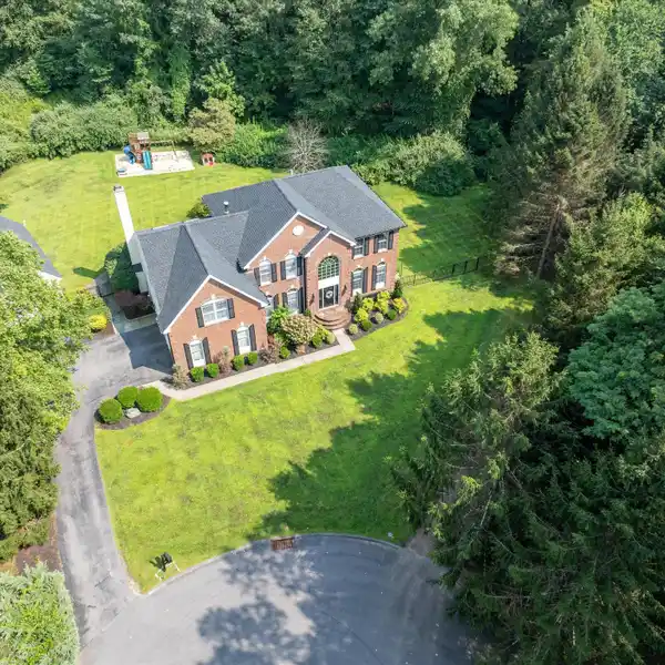 UPDATED COLONIAL HOME IN A BEAUTIFUL SETTING