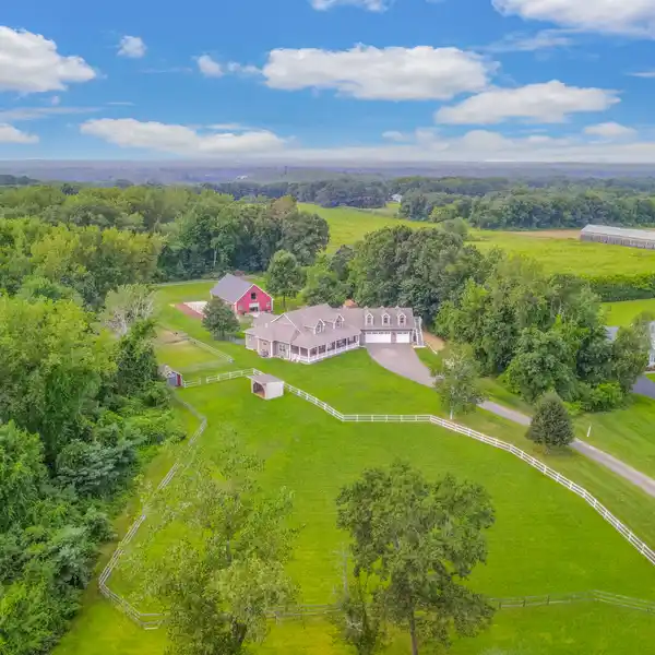 CUSTOM ESTATE WITH EXCEPTIONAL EQUESTRIAN FACILITIES