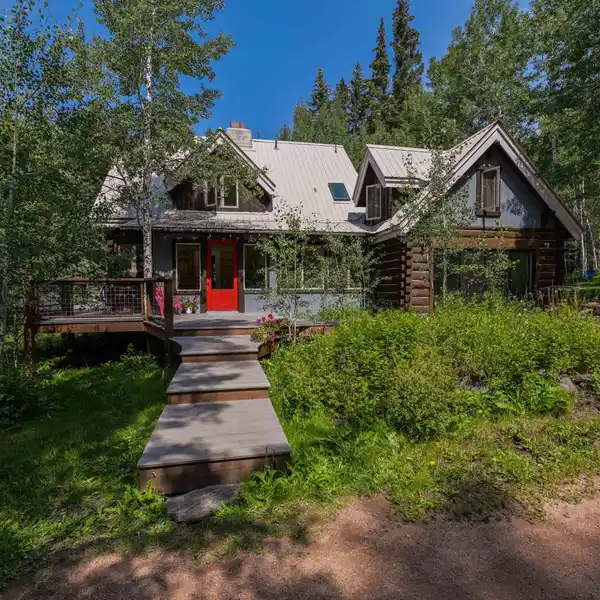EXTRAORDINARY CUSTOM-BUILT LOG AND TIMBER FRAME HOME ON FOUR SERENE ACRES