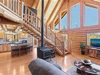 IMPECCABLY MAINTAINED LOG HOME ON NEARLY 40 ACRES