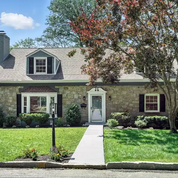 METICULOUSLY MAINTAINED AND TURN-KEY CAPE COD STYLE RESIDENCE