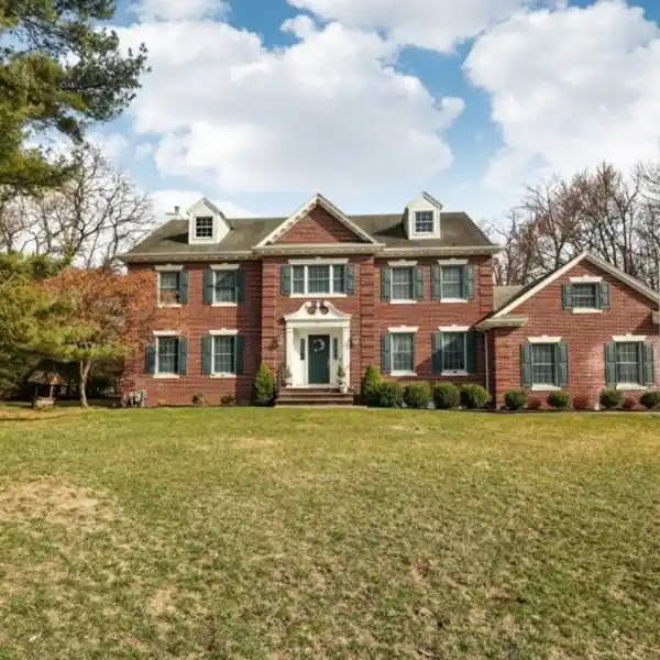 CUSTOM-BUILT BRICK-FRONT CENTER HALL COLONIAL