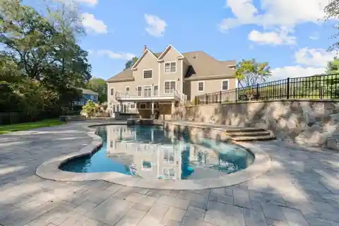 Gorgeous Woodland Setting with Custom Stone Walls and Landscaping