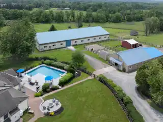 Nearly 11-Acre Equestrian Facility with Updated Cottage-Style Home