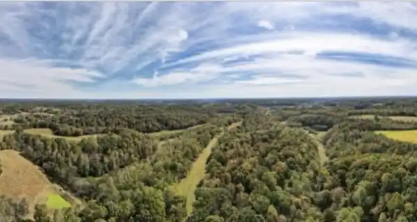 EXPANSIVE HILLTOP FARMSTEAD WITH SCENIC PASTURES