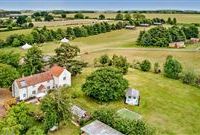 AN ATTRACTIVE PERIOD FARMHOUSE IN OVER 12 ACRES OF MAGNIFICENT GROUNDS