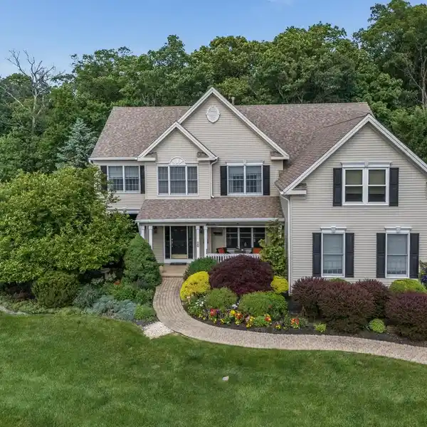 METICULOUSLY UPDATED COLONIAL WITH GOURMET KITCHEN & GYM