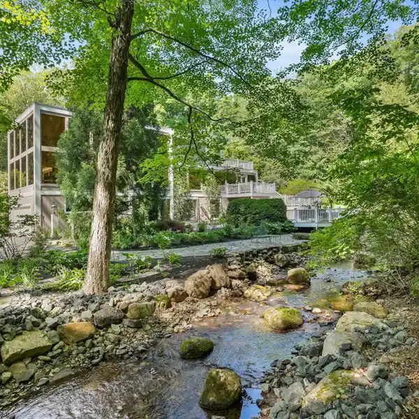 UNIQUE THREE-LEVEL RETREAT WITH EXPANSIVE DECKS