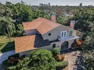 Grand Mediterranean Home with Covered Lanai and Arches
