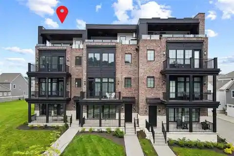 Distinctive Brownstone at the River's Edge