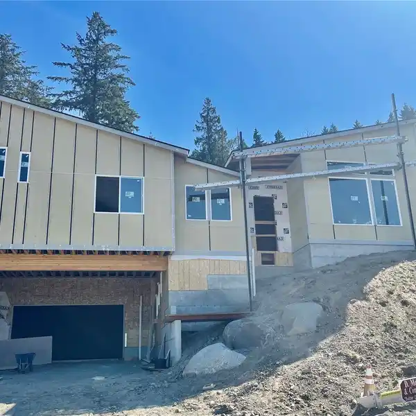 NEW ONE-STORY RAMBLER ON A CORNER LOT