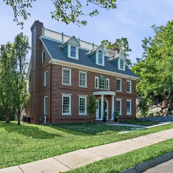 BRICK COLONIAL ON A PRESTIGIOUS CUL-DE-SAC