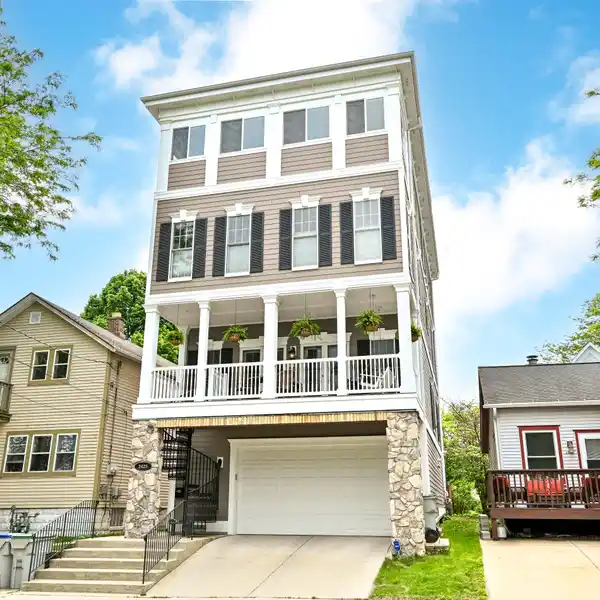 ONE-OF-A-KIND HOME WITH DRAMATIC LAKE AND DOWNTOWN VIEWS