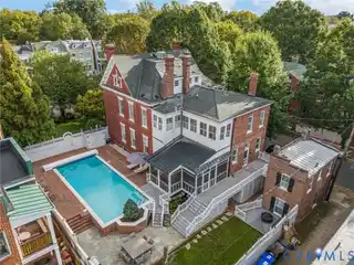 Architectural Masterpiece with Poolside Carriage Retreat