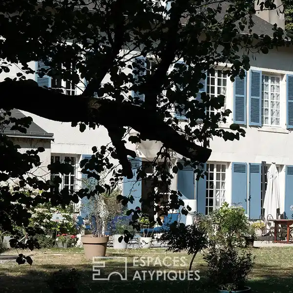 ELEGANT MANSION IN A GREEN SETTING