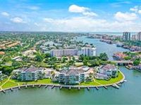 TOP-FLOOR CORNER CONDO WITH SWEEPING BAY VIEWS