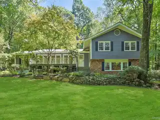Striking Frame and Brick-Front Split-Level Home