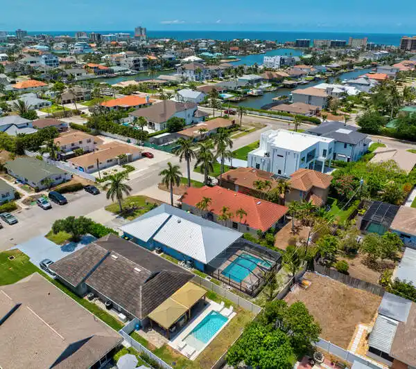 TURNKEY NAPLES HOME WITH INDOOR-OUTDOOR ENTERTAINING SPACES