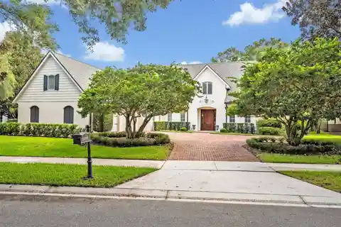 Soaring Ceilings, Brick Exterior, and Lush Landscaping