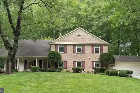 Stately Colonial Overlooking Serene Wooded Green Space