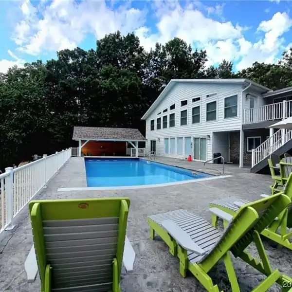 GATED LAKEFRONT RETREAT WITH ENTERTAINER’S DREAM