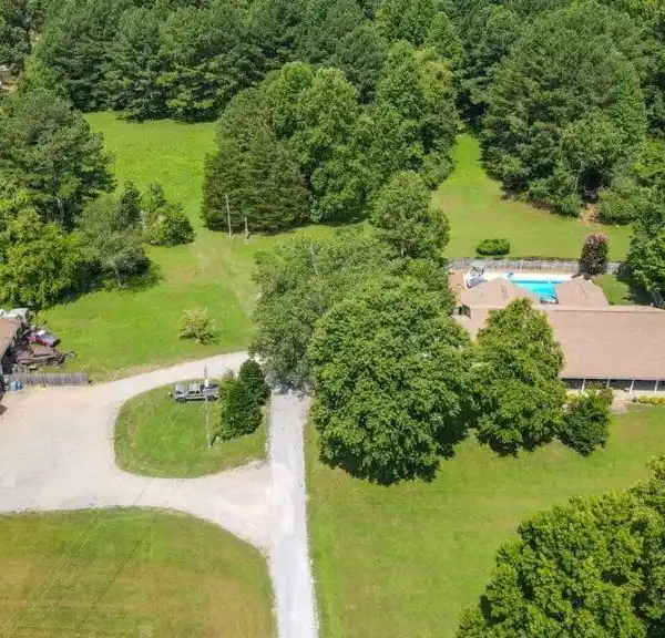 BEAUTIFUL THREE BEDROOM BRICK HOME ON 17 ACRES