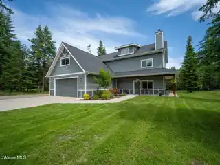 Grand Home with Wraparound Porch and Workshop