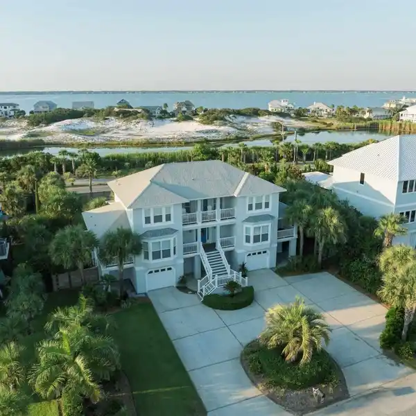 STUNNING STUCCO RESIDENCE STEPS FROM GULF ACCESS