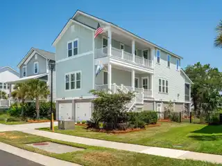 Elevated Living in a Revered Waterfront Community