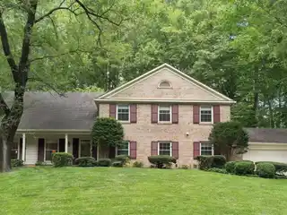 Stately Colonial Overlooking Serene Wooded Green Space