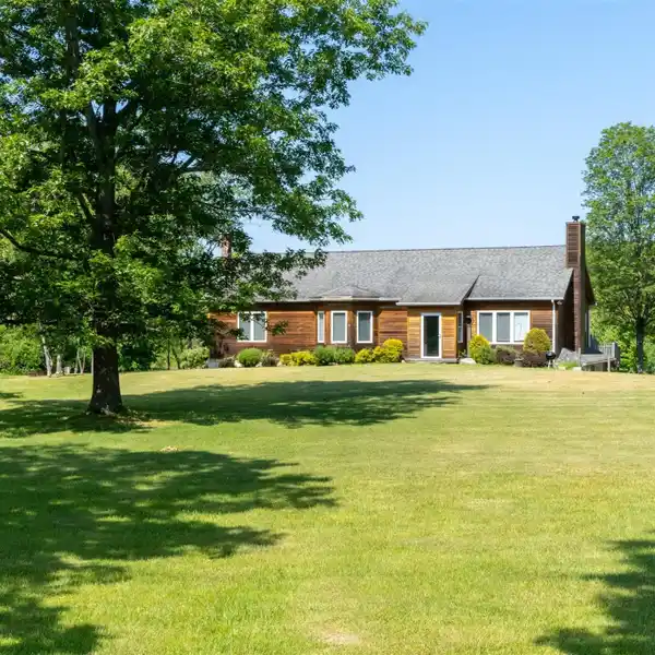 CEDAR-SIDED TRADITIONAL HOME ON 23 ACRES
