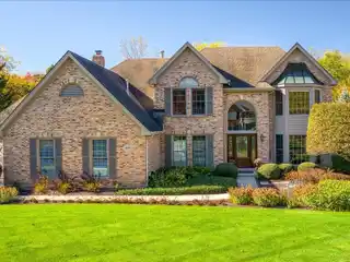 Luxury Living with Soaring Ceilings & Floor-To-Ceiling Stone Fireplace