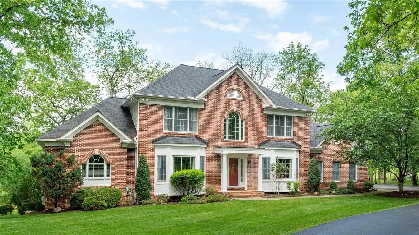Elegant Brick Colonial with Wooded Serenity