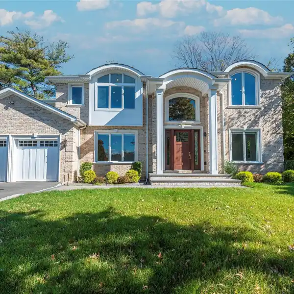 DISTINGUISHED BRICK COLONIAL FLOODED WITH NATURAL LIGHT