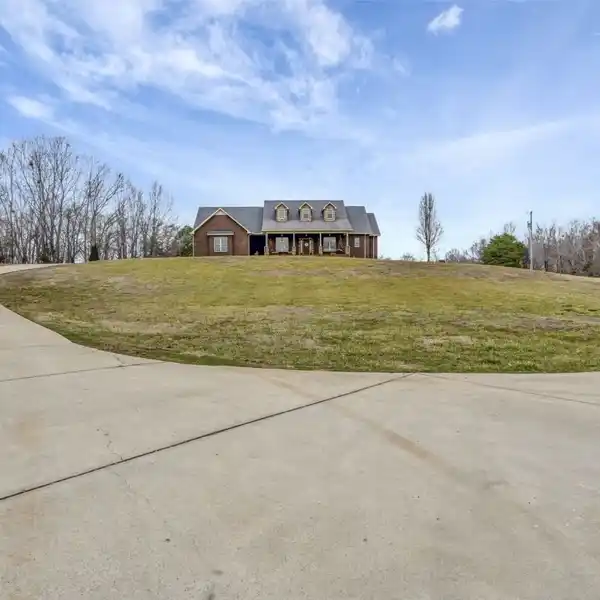 PRIVATE CUSTOM-BUILT HOME ON ACRES OF SERENE LAND