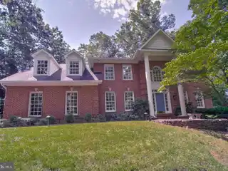 Impeccably Updated Brick Home with Outdoor Kitchen