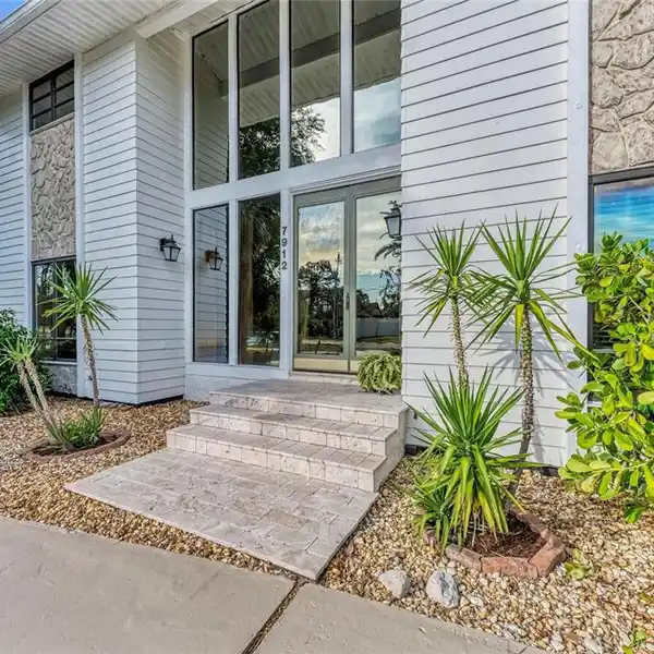 EXCEPTIONAL CUSTOM HOME ON A SPACIOUS CORNER LOT