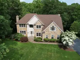 Elevated Elegance in Distinguished Wooded Enclave