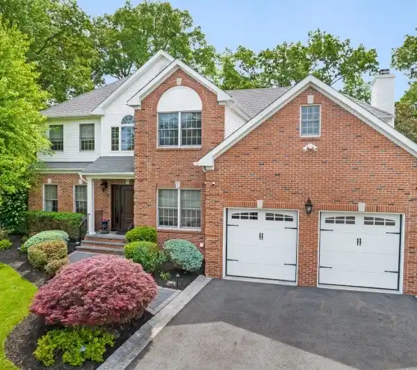 OUTSTANDING BRICK FRONT CENTER HALL COLONIAL