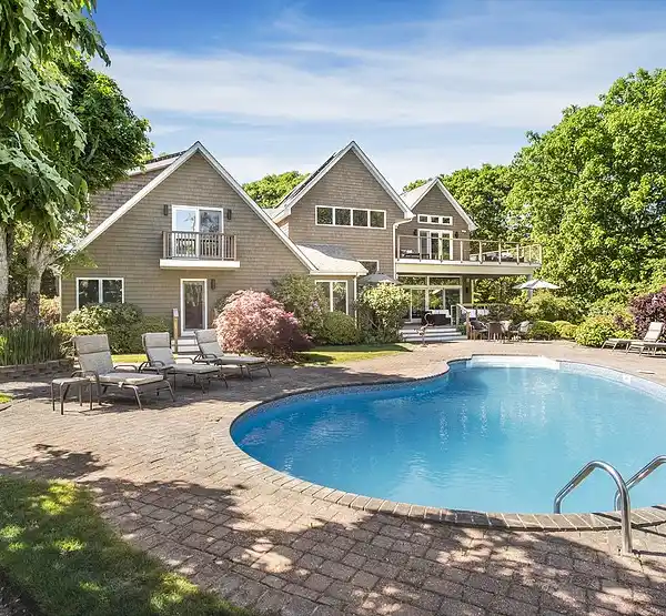 BEAUTIFUL HILLTOP HOME SURROUNDED BY WOODS