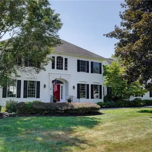 CUSTOM WOODSTONE HOME WITH EXCEPTIONAL UPGRADES