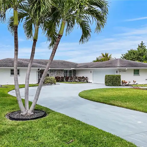 DEEP-WATER HAVEN WITH FULL WALL OF WINDOWS